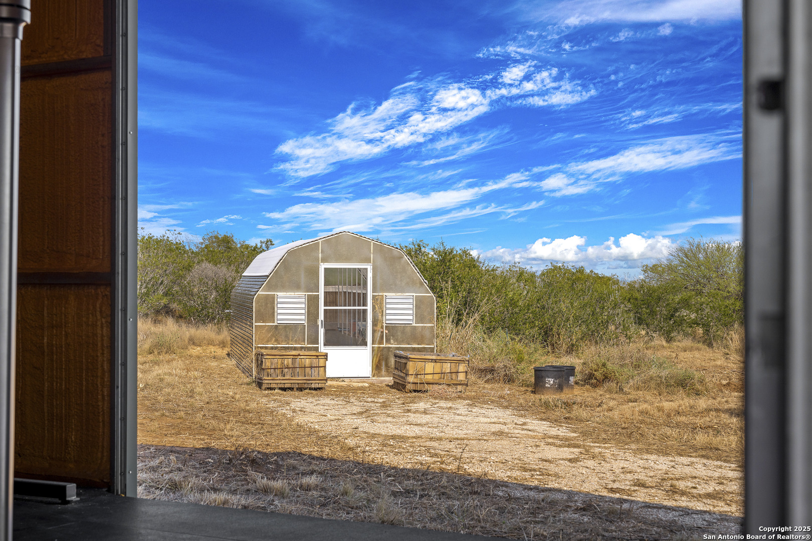 514 County Road 669 Devine, TX 78016 - Photo 42 of 45 a view of a house with a yard
