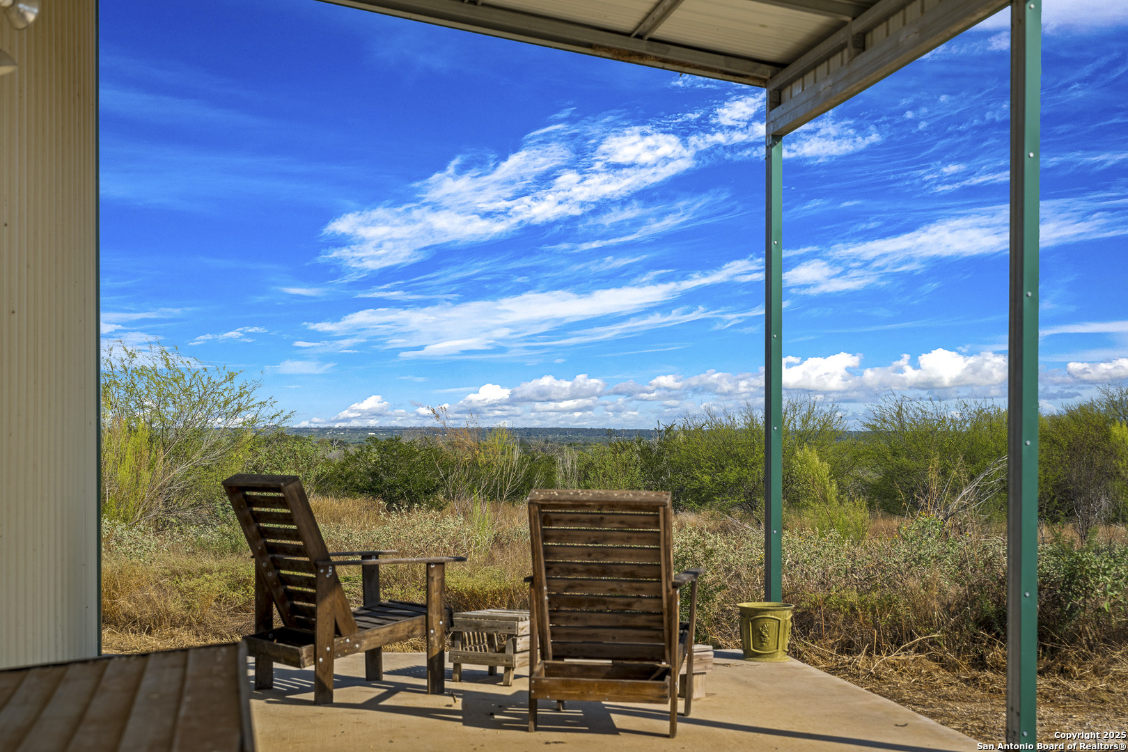 514 County Road 669 Devine, TX 78016 - Photo 43 of 45 a view of a balcony with chairs