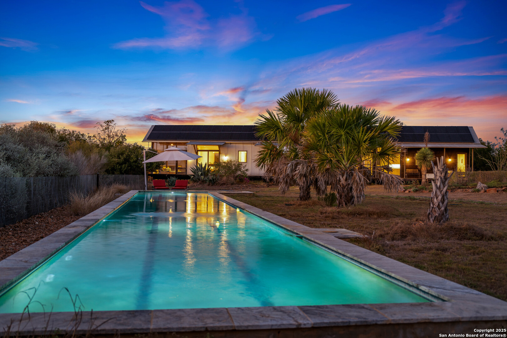 514 County Road 669 Devine, TX 78016 - Photo 5 of 45 a view of a swimming pool with an outdoor seating