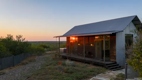 a view of a city with lush green forest