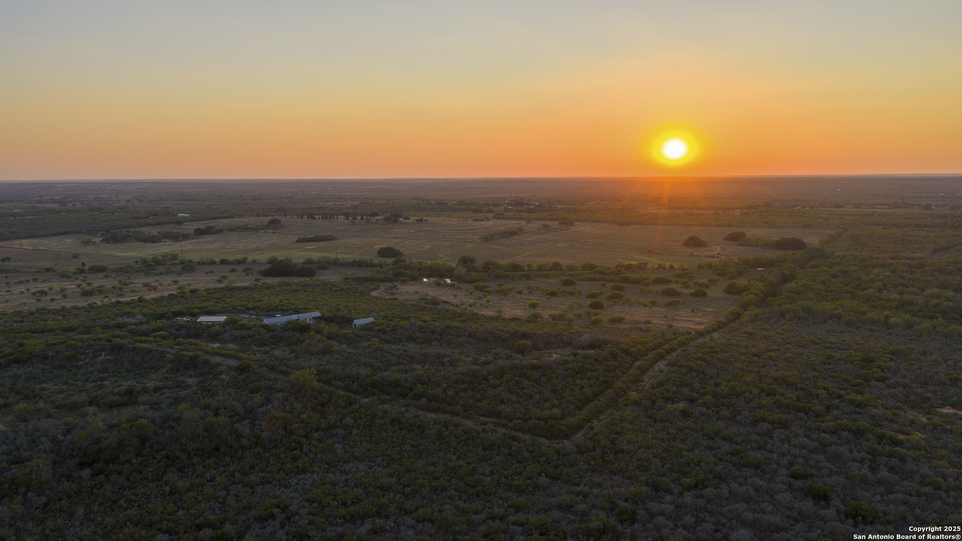 514 County Road 669 Devine, TX 78016 - Photo 9 of 45 a view of a city with lush green forest