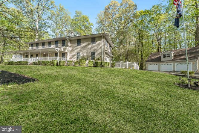1 Craig Road Annandale, NJ 08801 - Photo 3 of 61 a view of a house with a big yard and large trees