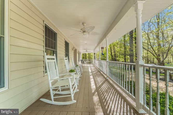 1 Craig Road Annandale, NJ 08801 - Photo 8 of 61 Charming porch with rocking chairs and greenery.