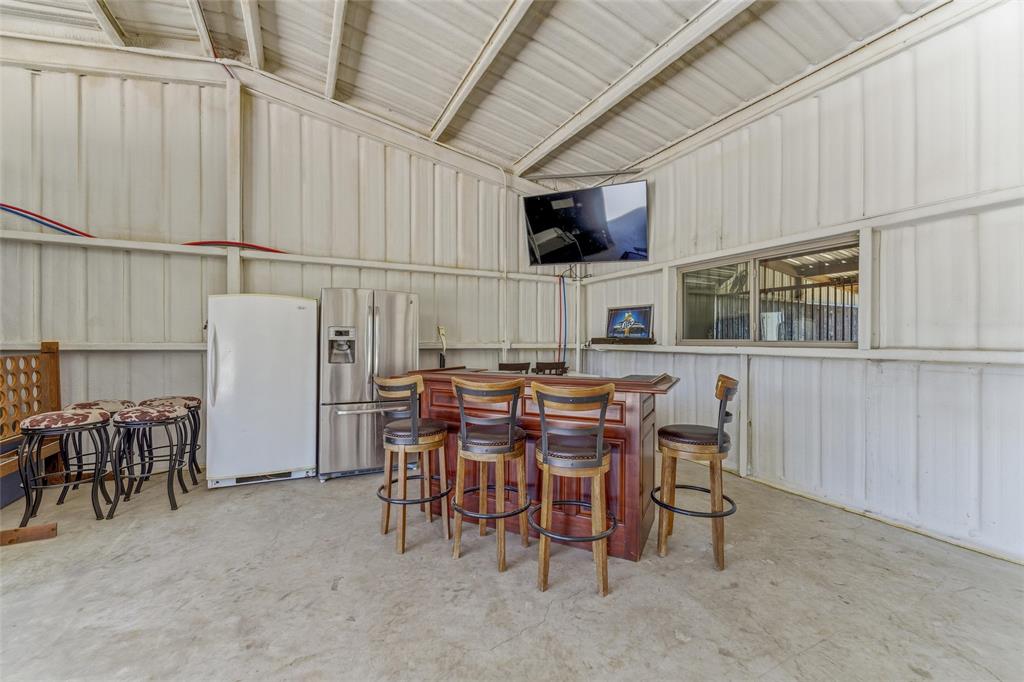 10106 Prather Road Springtown, TX 76082 - Photo 34 of 40 a view of a dining room with furniture