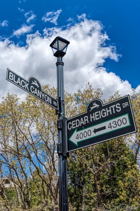 3455 Black Canyon Road Colorado Springs, CO 80904 - Photo 2 of 21 a street sign on a pole on a street