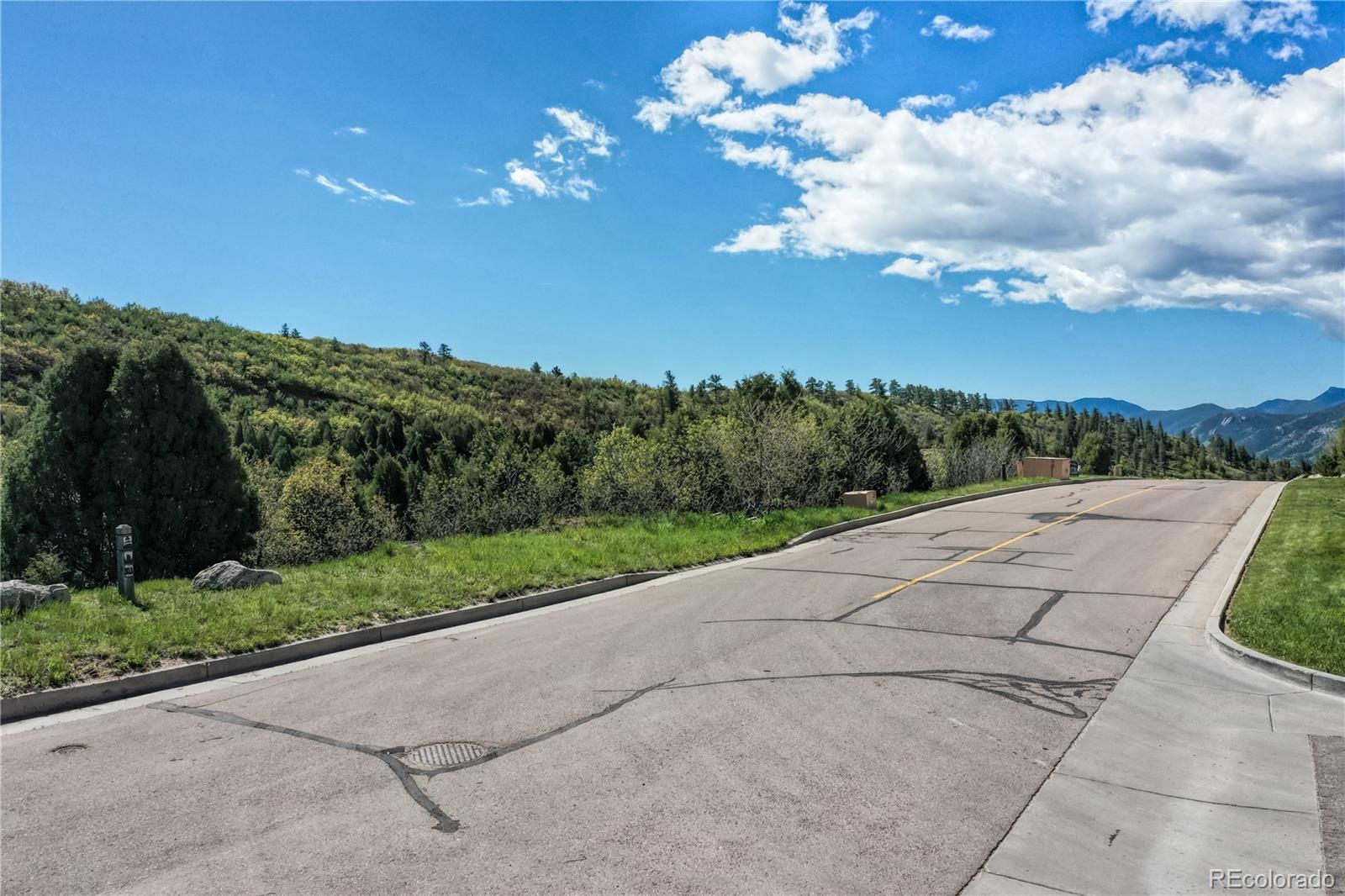 3455 Black Canyon Road Colorado Springs, CO 80904 - Photo 3 of 21 a view of a pathway with a yard