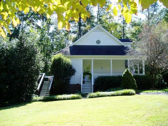 12000 Peed Road Raleigh, NC 27614 - Photo 3 of 12 a front view of a house with a yard