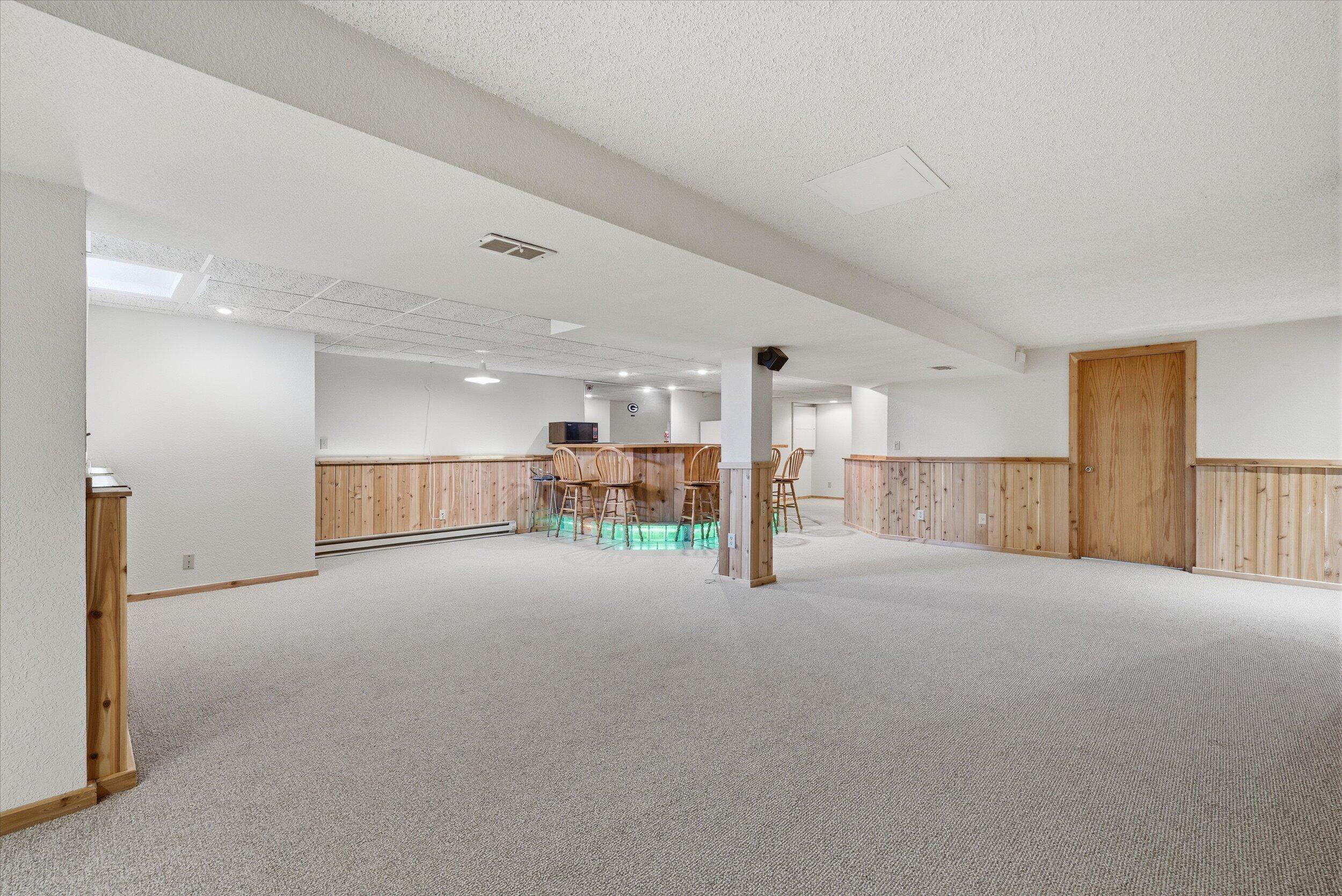 W178N9743 Riversbend Circle West Germantown, WI 53022 - Photo 22 of 40 Lower Level Rec Room w/wet bar