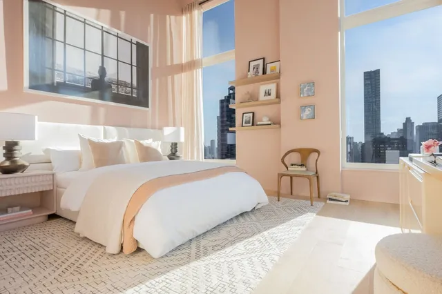 a bathroom with double sink and a mirror