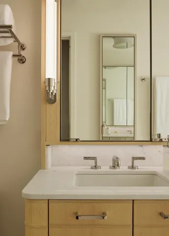 a bedroom with a bed and a cabinets