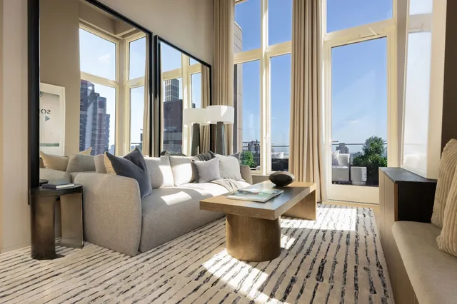 a view of a terrace with couches and potted plants