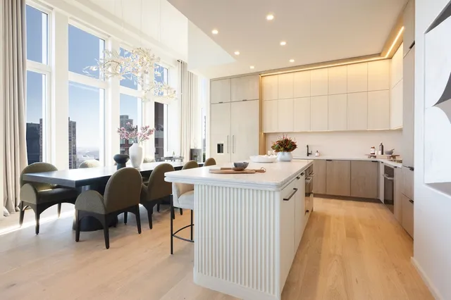 a view of a roof deck with furniture