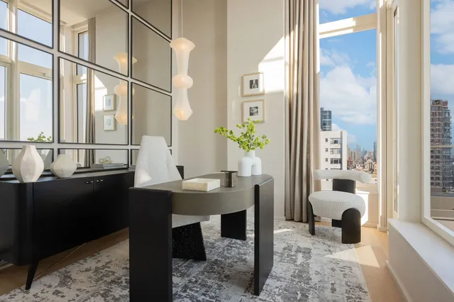 a dining room with furniture and window