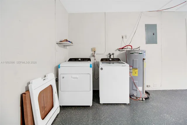 an empty room with a window and a ceiling fan