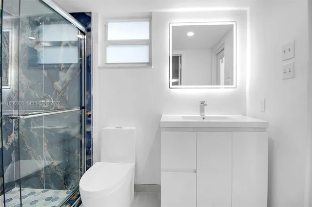 a bathroom with a shower and a toilet