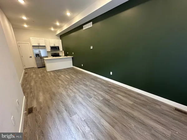 a view of a livingroom with wooden floor
