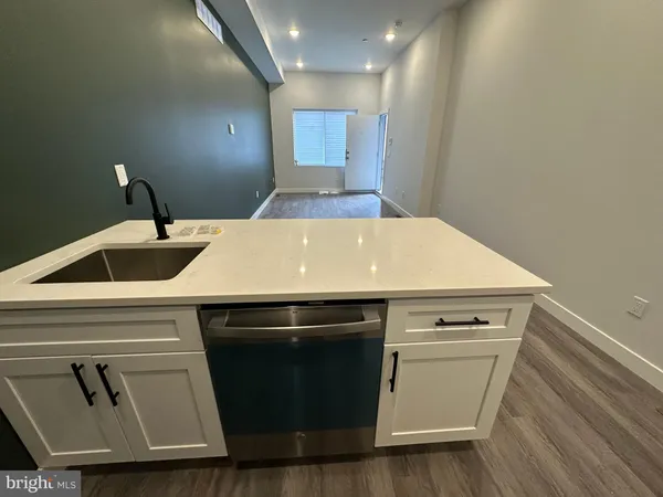 a kitchen with a refrigerator stove and microwave