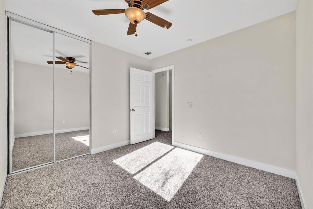 547 North Fillmore Avenue Rialto, CA 92376 - Photo 20 of 30 a view of a room with a ceiling fan and a window