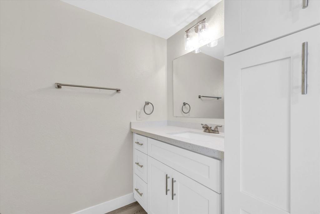 547 North Fillmore Avenue Rialto, CA 92376 - Photo 24 of 30 a bathroom with a sink and a mirror