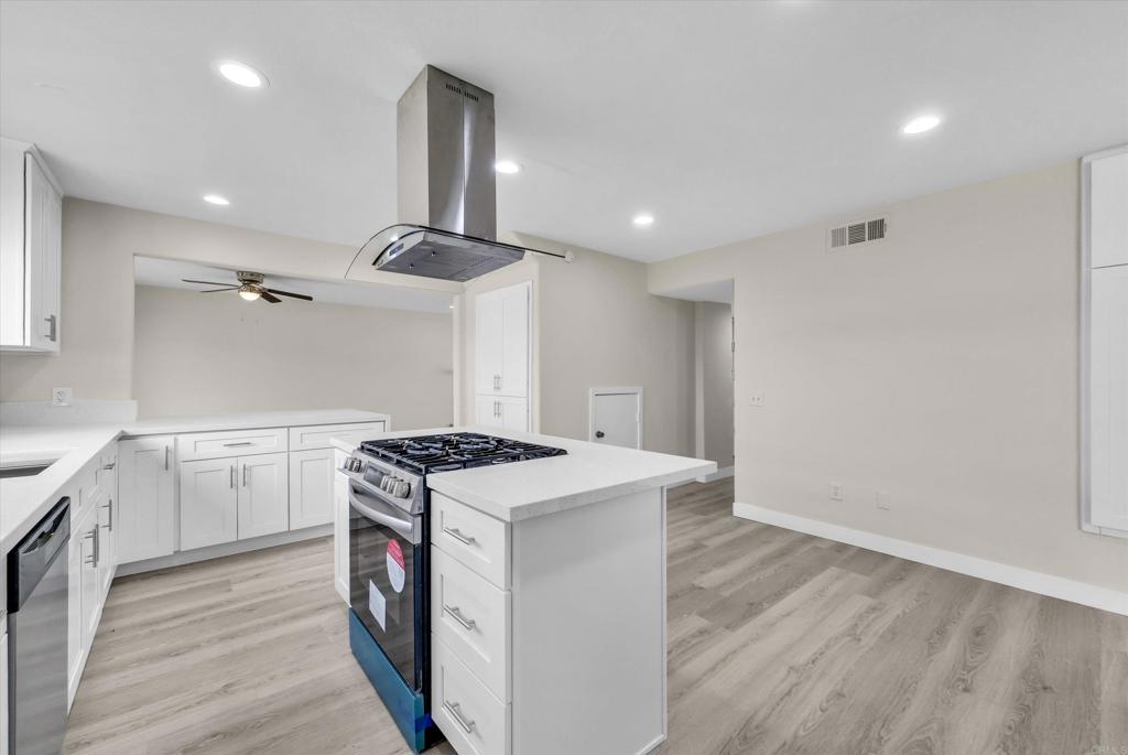 547 North Fillmore Avenue Rialto, CA 92376 - Photo 25 of 30 a kitchen with a stove sink and cabinets