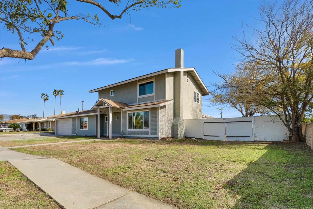 547 North Fillmore Avenue Rialto, CA 92376 - Photo 28 of 30 a front view of a house with a yard
