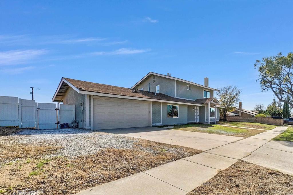 547 North Fillmore Avenue Rialto, CA 92376 - Photo 30 of 30 a front view of a house with a yard