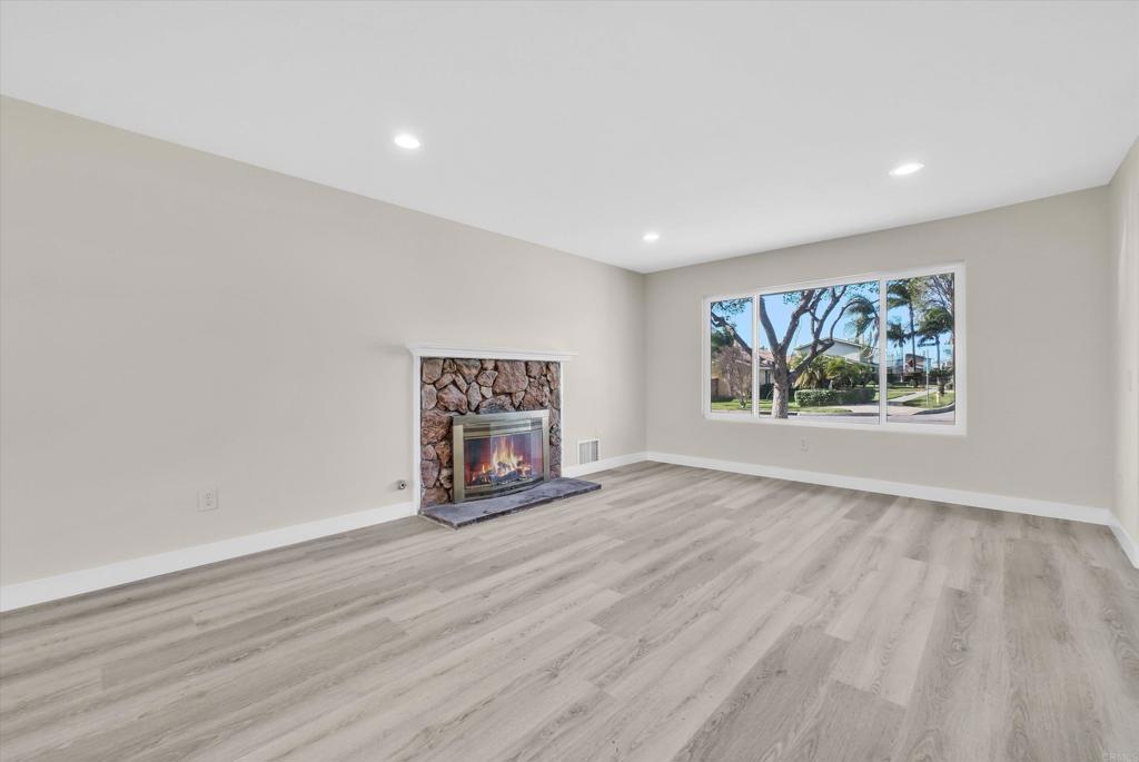 547 North Fillmore Avenue Rialto, CA 92376 - Photo 5 of 30 a view of an empty room with wooden floor and window