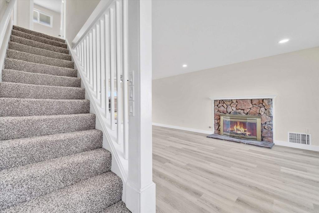 547 North Fillmore Avenue Rialto, CA 92376 - Photo 6 of 30 a view of staircase with white walls and a window