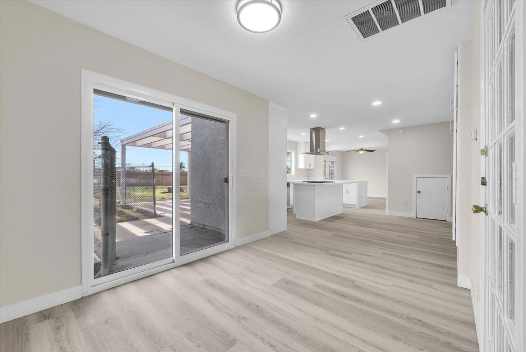 547 North Fillmore Avenue Rialto, CA 92376 - Photo 8 of 30 a view of a kitchen with a sink and a refrigerator