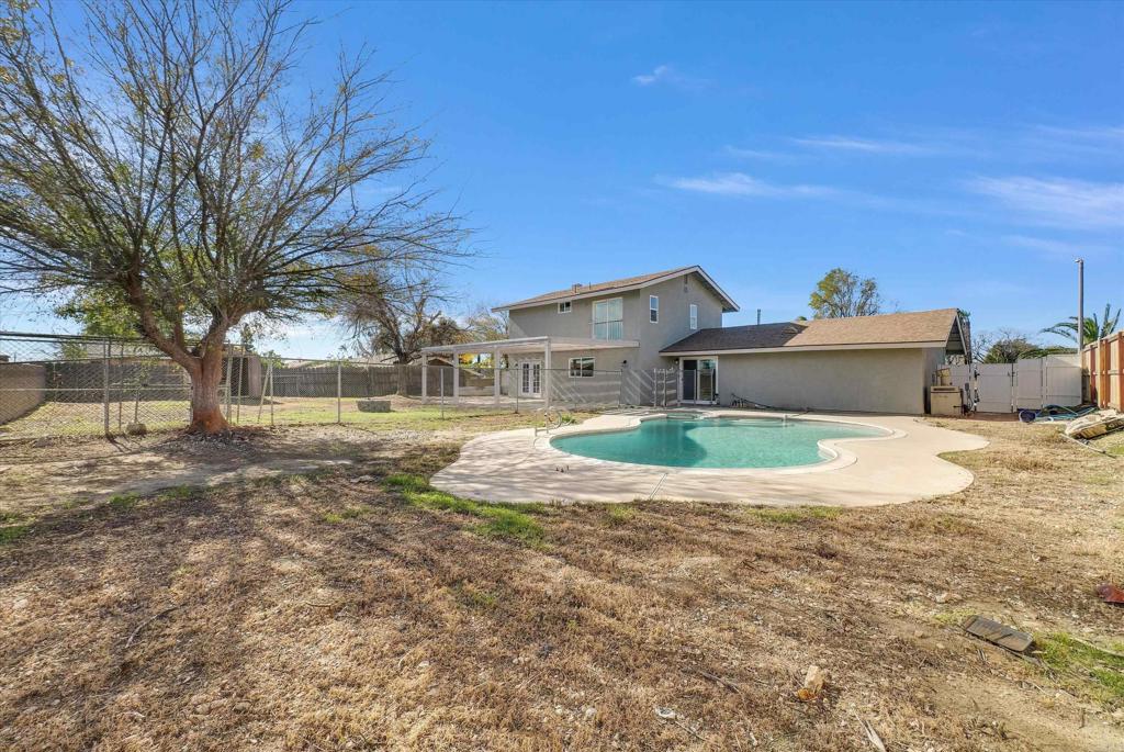 547 North Fillmore Avenue Rialto, CA 92376 - Photo 9 of 30 a view of a house with a yard