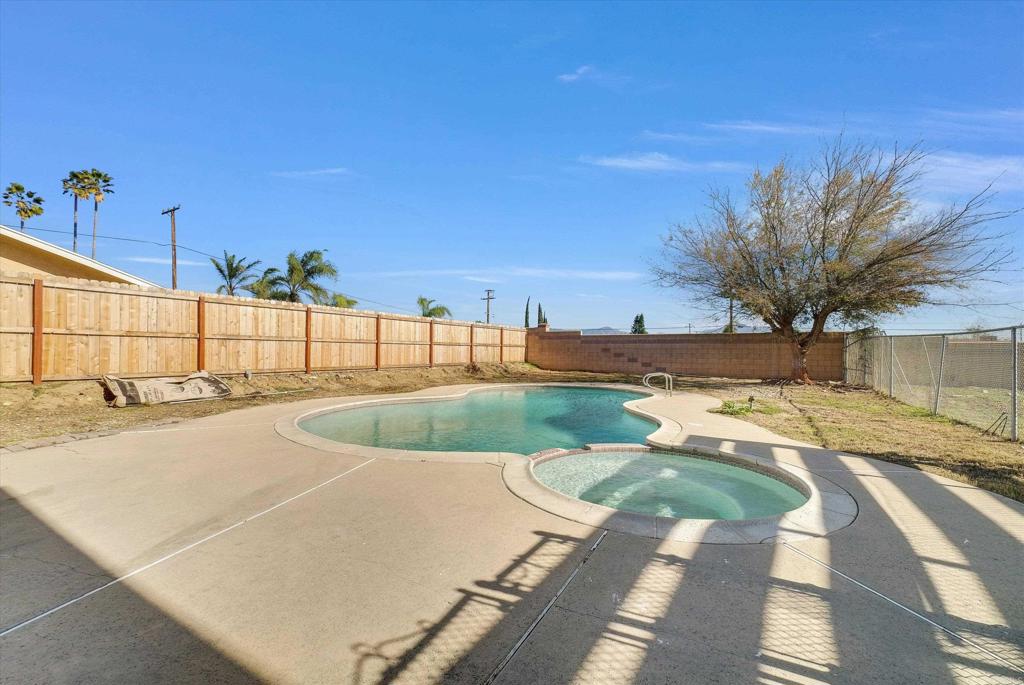 547 North Fillmore Avenue Rialto, CA 92376 - Photo 10 of 30 a view of a swimming pool with a lounge chairs