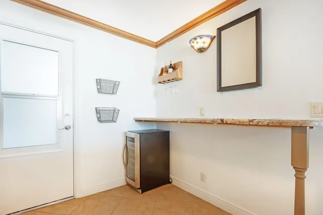 a living room with furniture large window and a flat screen tv