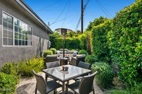 a table and chairs in a patio