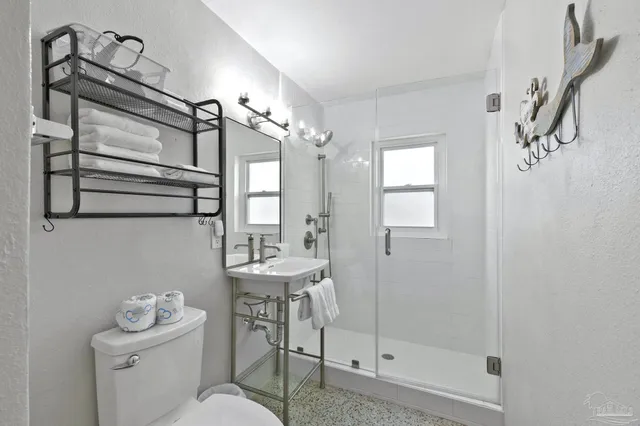 a kitchen with stainless steel appliances a refrigerator sink and microwave