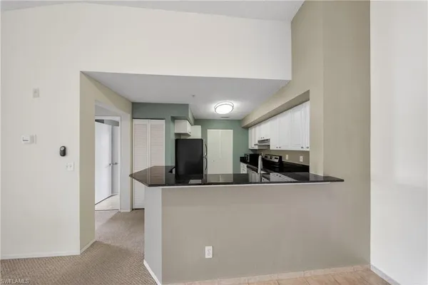 a view of a kitchen with a sink