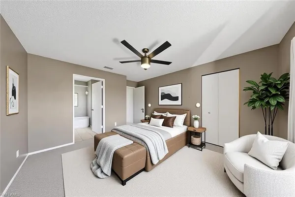 a bedroom with bed couch and window