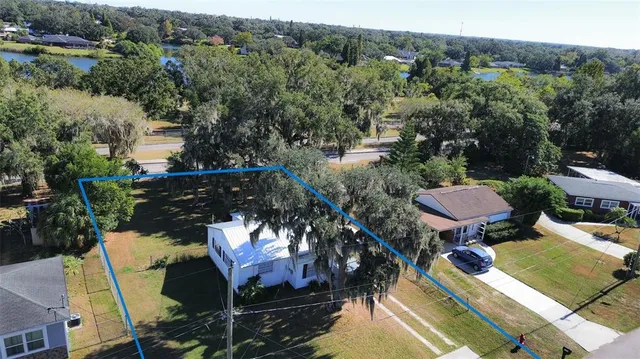 an aerial view of a house having yard
