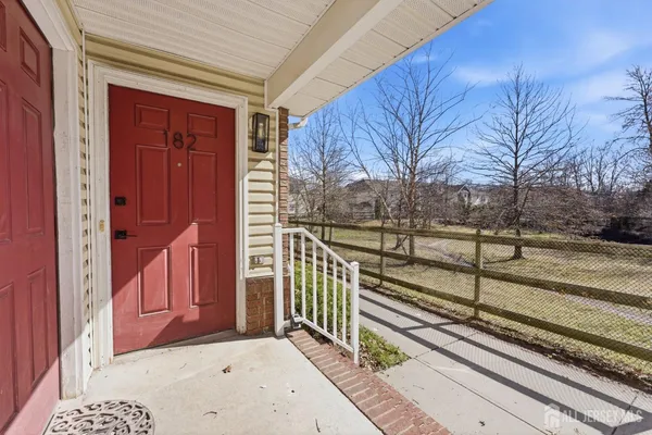 a view of a house with a red gate