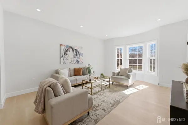 a living room with furniture and a large window