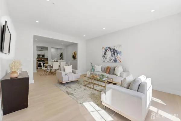a living room with furniture and a table