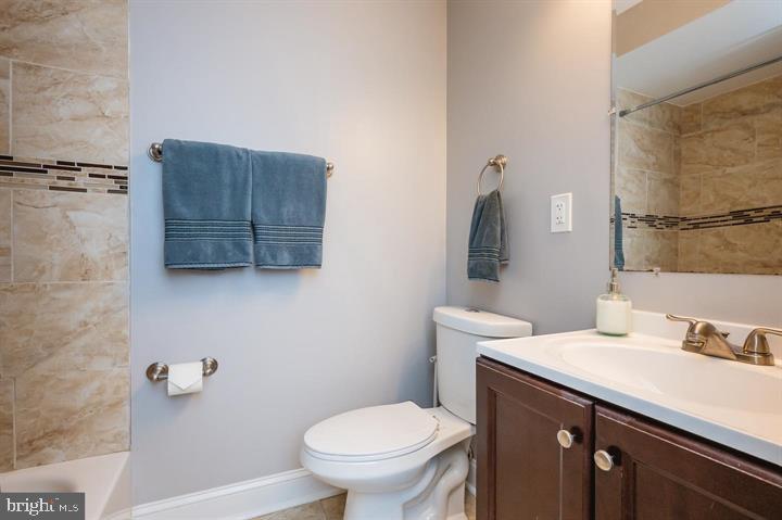 814 Foxwell Road Joppa, MD 21085 - Photo 11 of 23 a bathroom with a granite countertop sink a toilet and a mirror