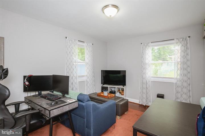 814 Foxwell Road Joppa, MD 21085 - Photo 14 of 23 a living room with furniture and a flat screen tv