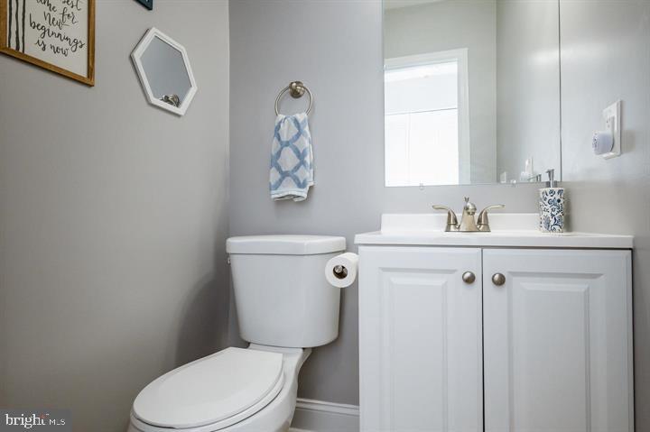 814 Foxwell Road Joppa, MD 21085 - Photo 16 of 23 a white toilet sitting next to a bathroom sink
