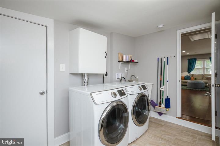 814 Foxwell Road Joppa, MD 21085 - Photo 19 of 23 a view of storage and utility room with washer and dryer