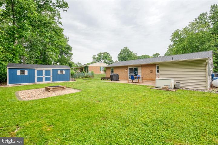 814 Foxwell Road Joppa, MD 21085 - Photo 22 of 23 a view of a yard with a house and a large tree