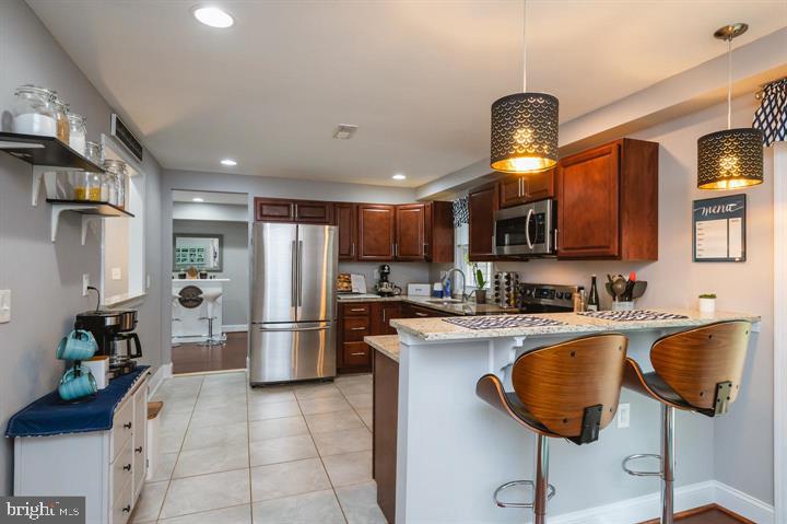 814 Foxwell Road Joppa, MD 21085 - Photo 3 of 23 a kitchen with refrigerator and cabinets