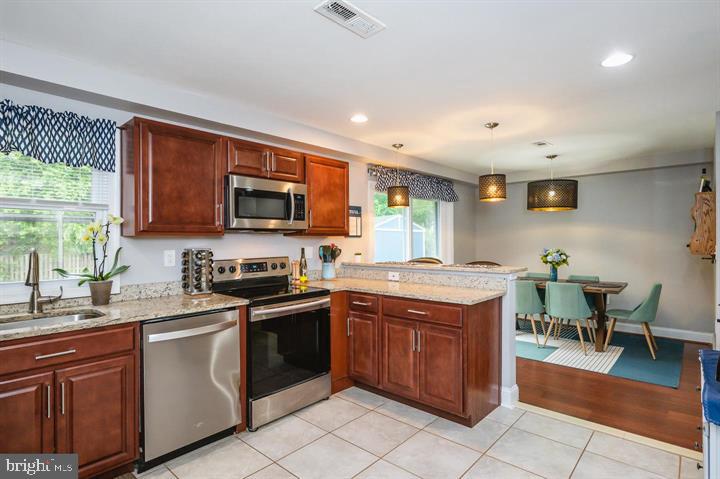 814 Foxwell Road Joppa, MD 21085 - Photo 4 of 23 a kitchen with a stove sink and microwave