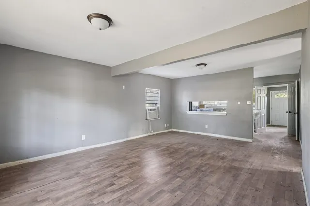 a view of a livingroom with wooden floor