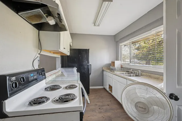 a utility room with sink dryer and washer
