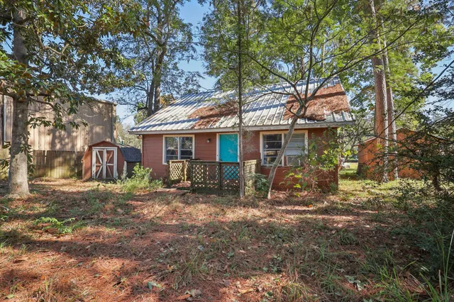 a front view of a house with yard